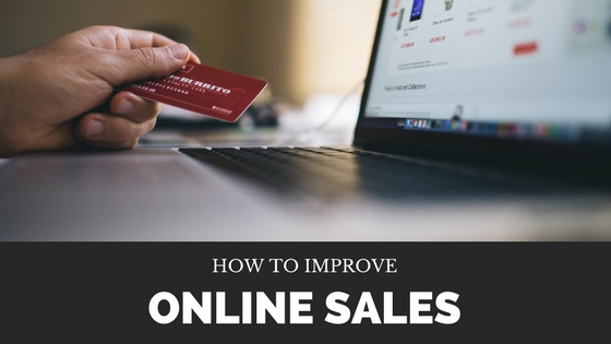 Person sitting with a laptop open to an online shopping page, holding a credit card, image used for Lisa Laporte blog about how to boost your online sales